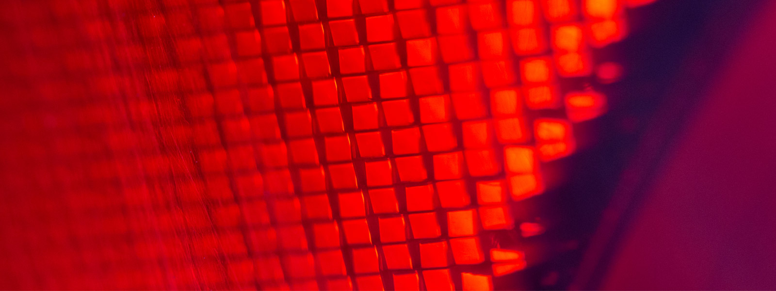 Abstract warm red and orange textured background with soft glowing shadow